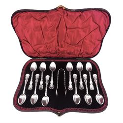 Set of ten Victorian silver coffee spoons, each with shaped scroll design rim, and a matching pair of sugar tongs, hallmarked Lee & Wigfull, Sheffield 1897, in tooled leather burgundy velvet and silk lined fitted case 