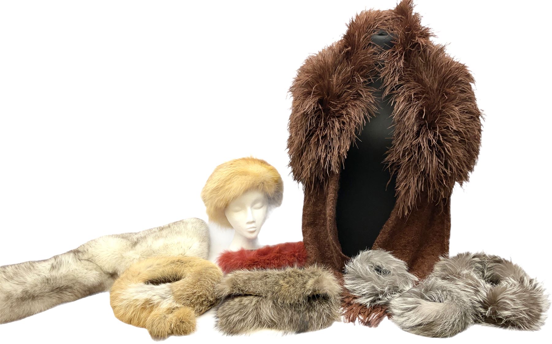 White Saga fox stole, together with Cresta Red fox fur hat, Red fox fur headband, a fur headband and matching cuffs, Harris Tweed clutch bag with fur trim, a fur clutch bag and an Ostrich feather and mohair scarf. 