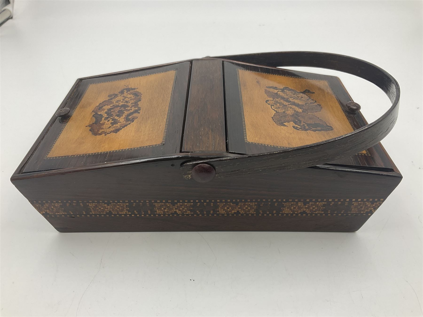 19th century rosewood Tunbridge Ware basket, of rectangular form with curved bentwood handle, and twin hinged sloping covers, lifting to reveal paper lined interiors, not including handle H5.5cm D10.5cm L18cm