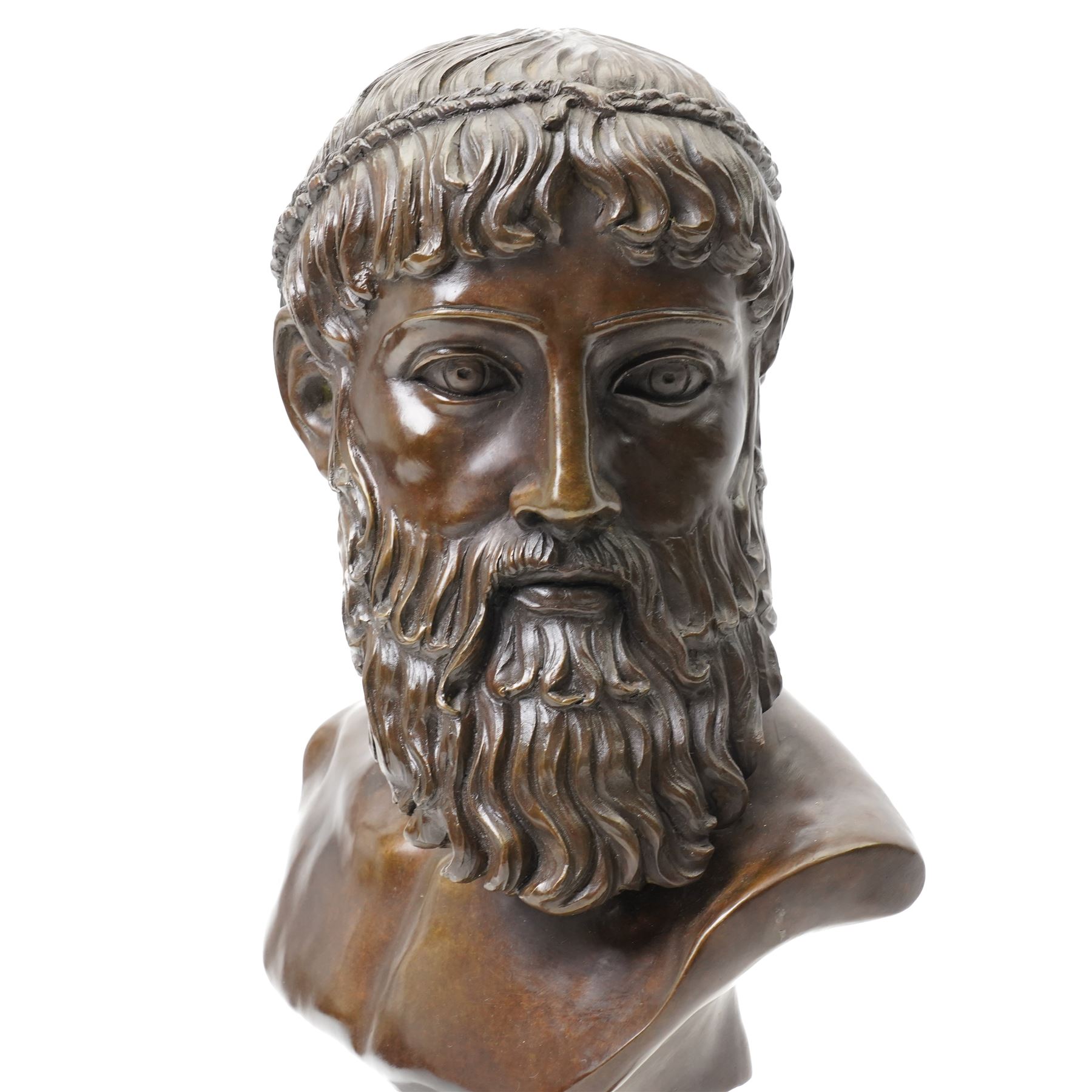 After the antique – a bronze bust modelled on the Artemision Bronze depicting the Greek god Zeus, the bearded head with intense gaze and idealised Classical features, raised on a marble plinth, H49cm Notes: the original is now held at the Archaeological Museum of Athens after being recovered from the sea off Cape Artemision