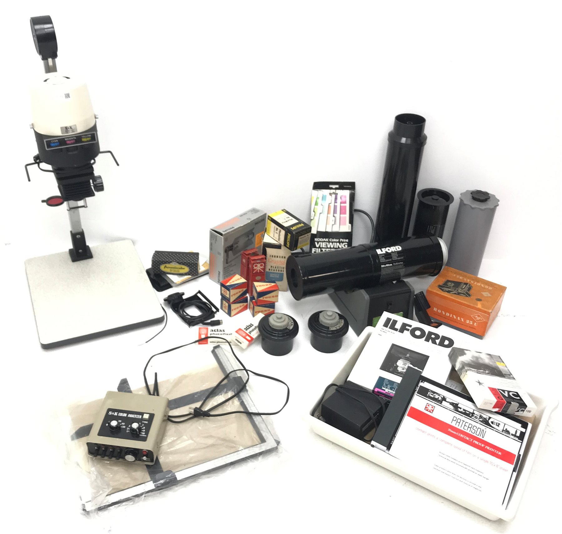 Large quantity of photo developing, dark room and photography equipment - quantity of Fogro 2'' x 2'' slide frames, PHILIPS movielight PSG125, Paterson 2 print forceps, atlas photo flash M3 clear, two Paterson 35mm developing tanks, Ilford photography paper 12'' x 16''and 8'' x 10'', Fujifilm photography paper 8'' x 10'' and 12'' x 16'', Rondinax 35U developing tank boxed, Simma Roller, two Ilford processing drums 30x40cm and 20x25cm, two other processing drums, Paterson 35mm contact proof printer, S&K 60D-C colour analyser etc... in three boxes