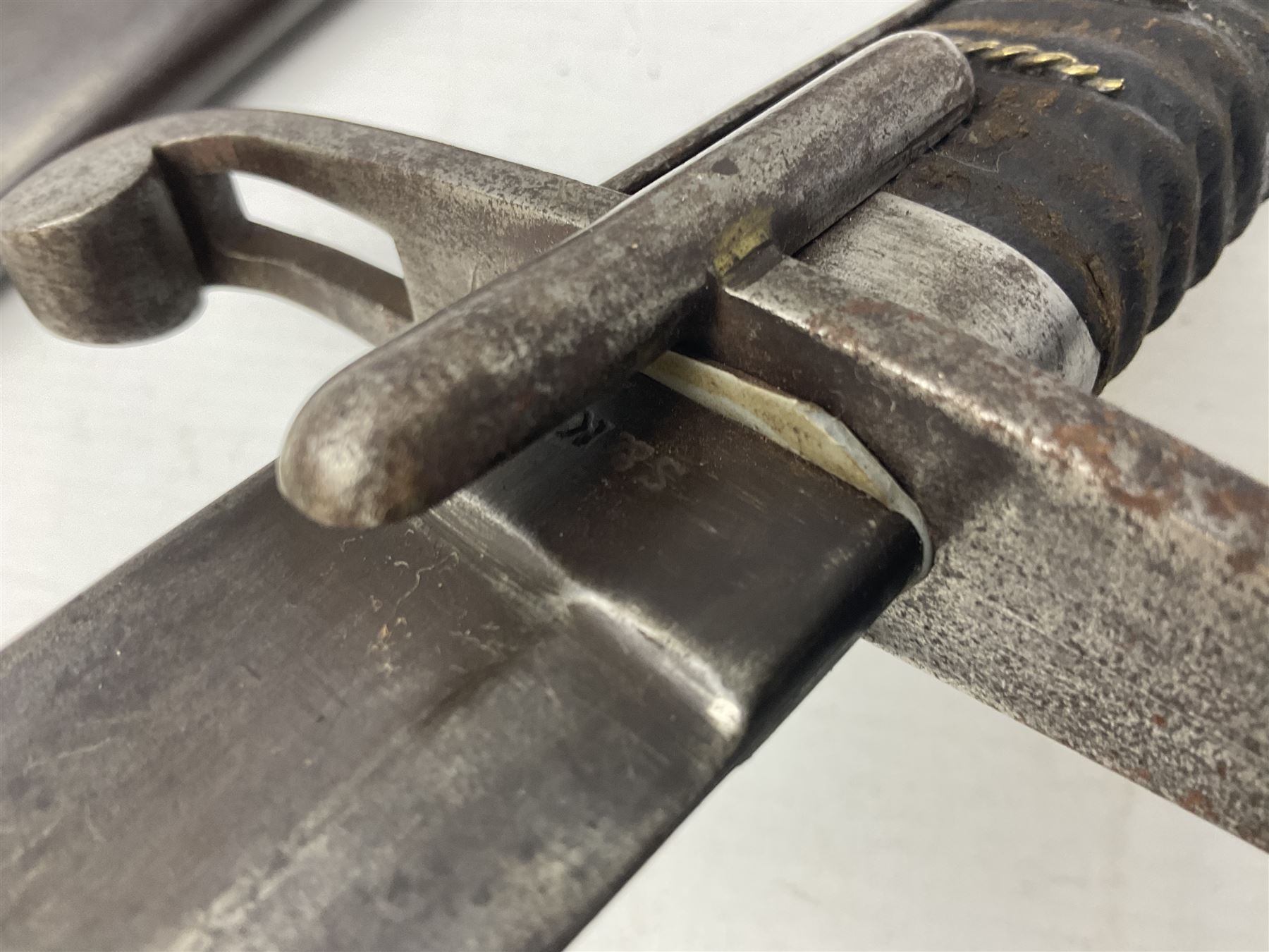 Italian M1833 Sabre with slightly curving 79cm fullered steel blade, the plain steel hilt with 'D' shaped knuckle bow, langets and wire-bound leather grip; in steel scabbard with single hanging ring L101cm overall