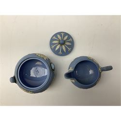 Late 19th century pale blue Wedgwood Jasperware cheese dome with cover, decorated with acorn and oak leaf bands surrounding neo-classical ladies, cherubs, flowers and trees, impressed Wedgwood mark beneath, together with further Wedgwood Jasperware teapots, boxed dishes etc