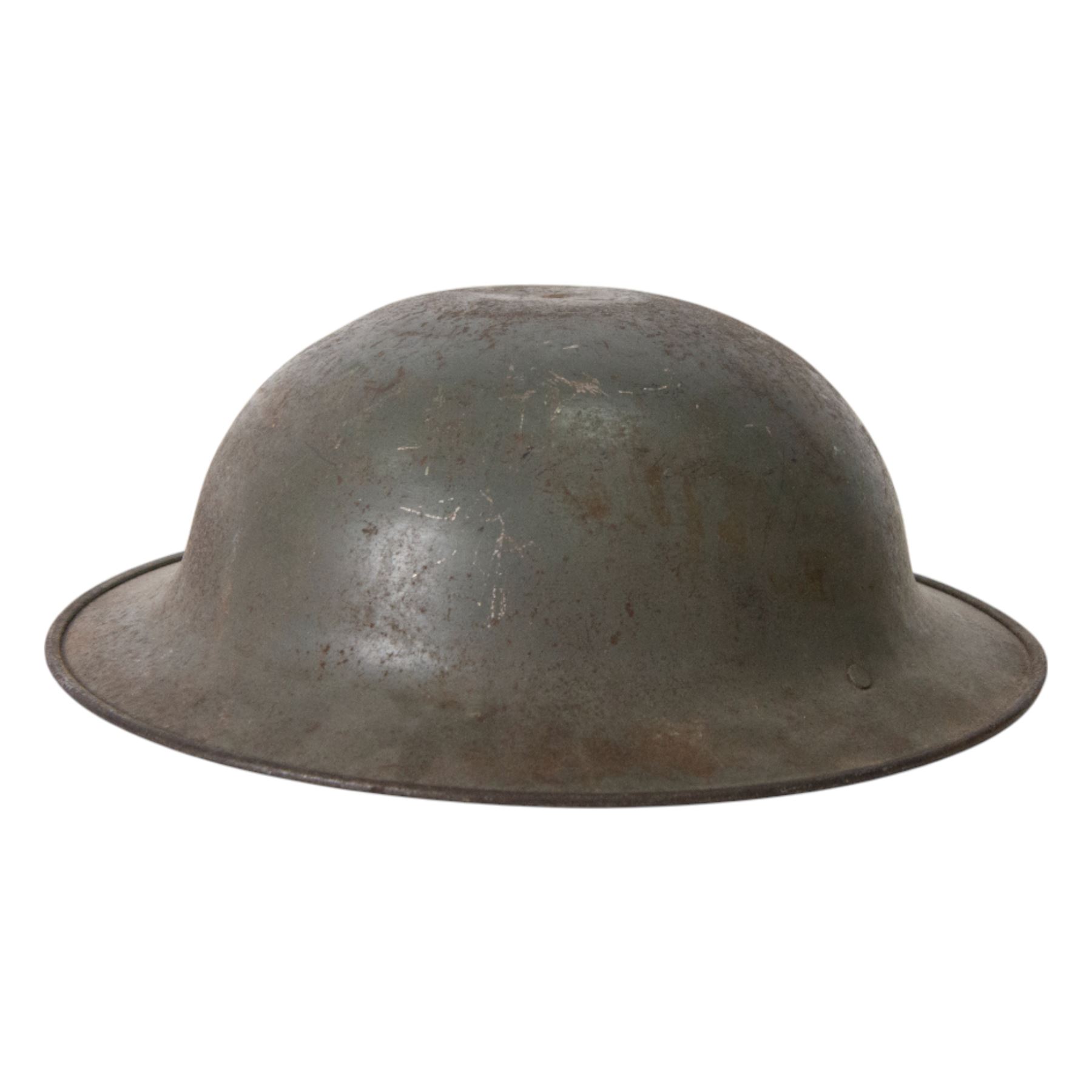 WWII Indian Army steel helmet, with chinstrap, together with Portuguese M30 steel helmet with liner and leather chin strap 