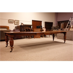  Large Victorian mahogany telescopic action extending dining table, moulded top with rounded corners, on lobed tapered supports with brass sockets and castors, with three additional leaves, L350cm, W137cm, H74cm max   