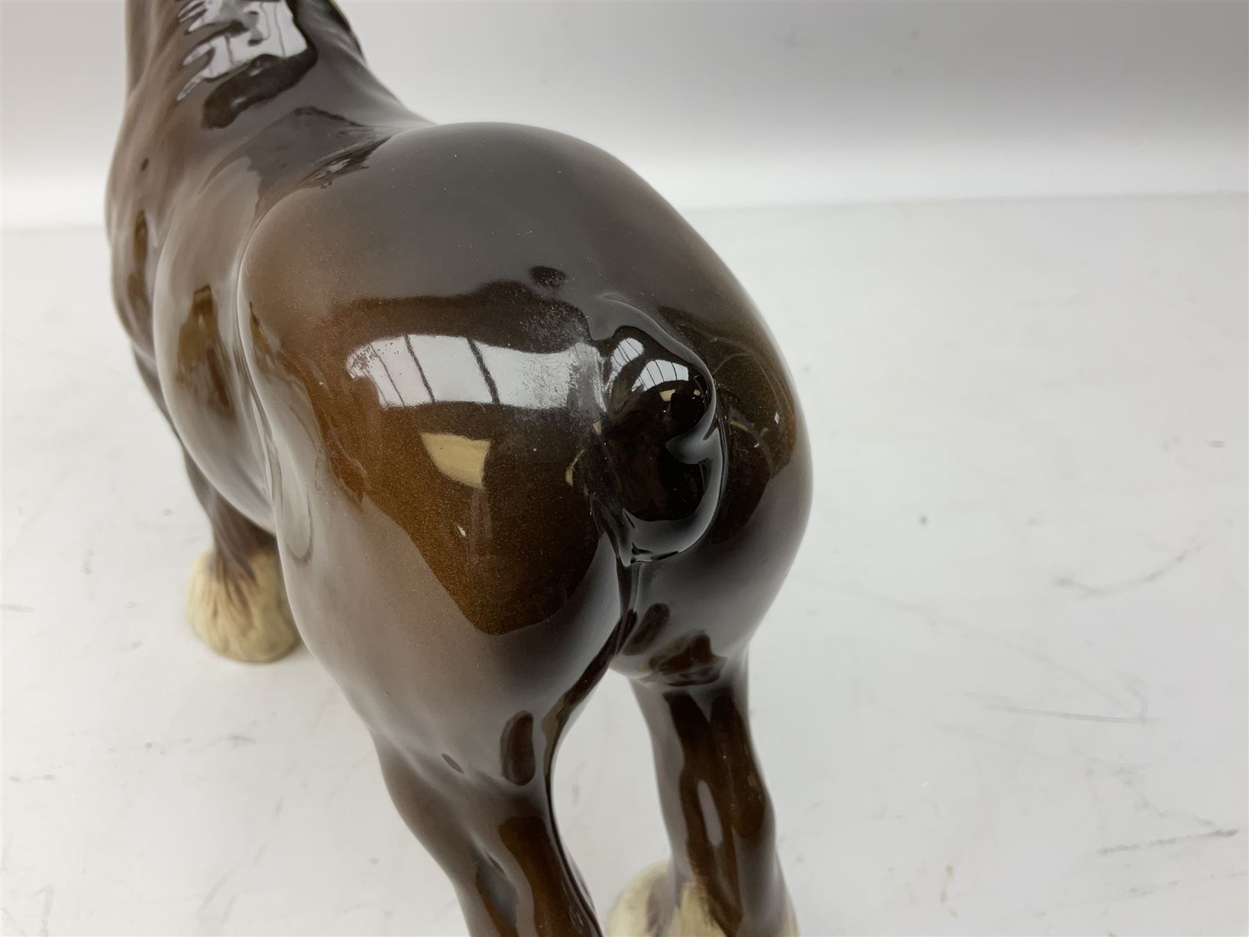 Three Beswick models comprising Hereford Bull no 949, 'CH Cutmil Cupie' Pug, and bay Shire horse, all with printed marks beneath