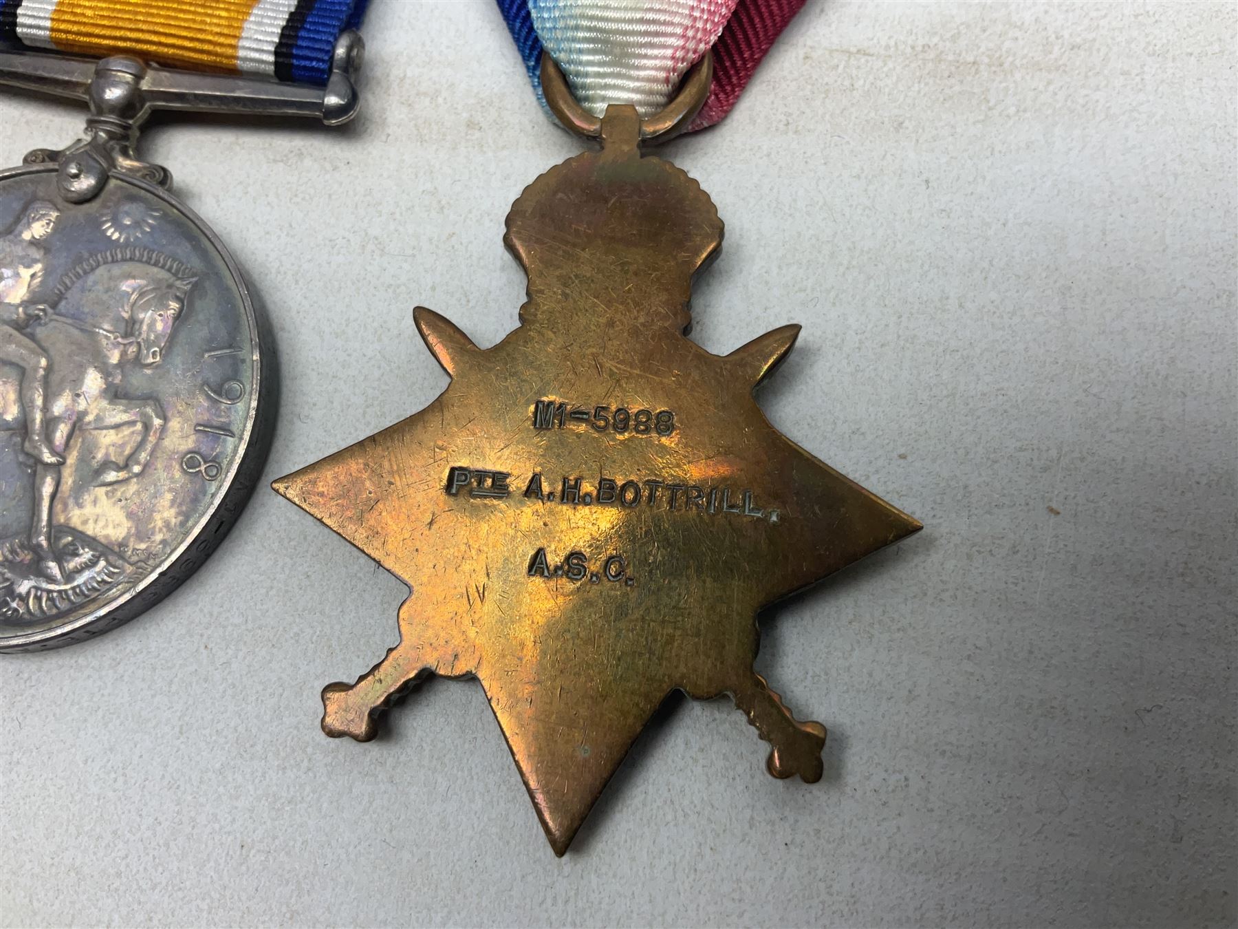 WW1 1914 “Mons Bar” medal trio comprising British War Medal, 1914 star with copy '5th Aug – 22nd Nov 1914' bar and Victory Medal awarded to M1-5988 Pte. A.H. Bottrill A.S.C.; with ribbons