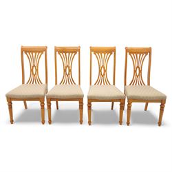 Late 20th century parquetry veneered extending dining table and eight chairs, the rectangular top with canted corners decorated with geometric parquetry panels, moulded edge frieze with repeating carved detail, raised on twin pedestal supports with fluted columns and shaped platform bases, the chairs with pierced splat backs and upholstered drop-in seats
Extends on a central leaf to 208cm