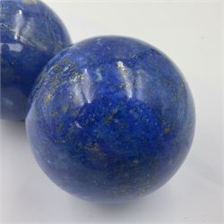 Pair of Lapis lazuli spheres, upon a carved stone stands, D8cm