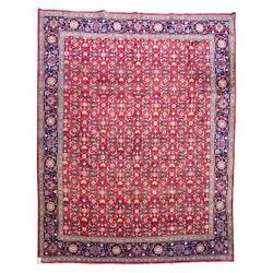 North West Persian Tabriz hand-knotted carpet, herati-type field in deep red with an all-o...