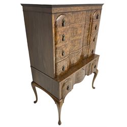 Early to mid-20th century figured walnut chest on stand, four graduating drawers on stand fitted with single drawer, drop handles in the form of shields with three recumbent lions, on cabriole supports