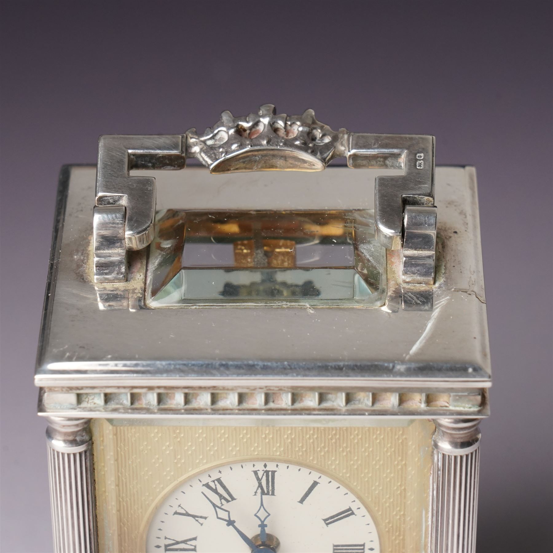 Chas Frodsham -  Miniature carriage clock with platform lever escapement commemorating the marriage of Prince Charles and Lady Diana Spencer, the white dial with an engine turned gilt surround and fleur de lis in silver case with fluted columns and bevelled glass panels H10cm  No.43/1000 London 1981 with key