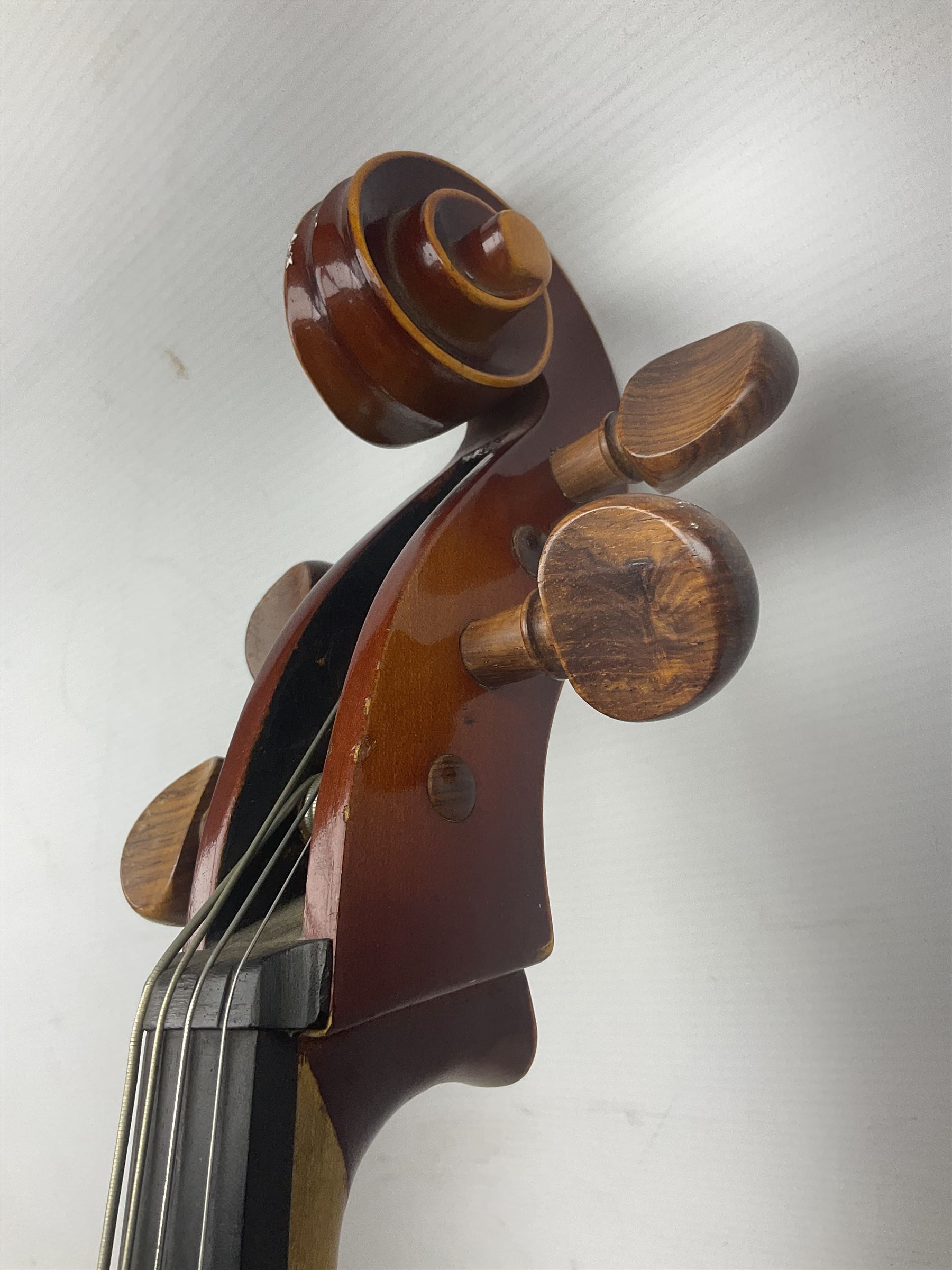 Two student half-size cellos - Boosey & Hawkes Artia with 65cm one-piece back and spruce top; bears maker's label; L104cm overall; and Romanian with 65.5cm two-piece maple back and ribs and spruce top; bears label; L108.5cm overall; each in soft carrying case with two bows (2)