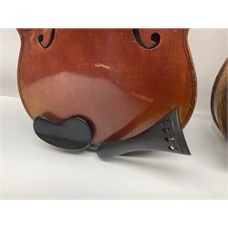 Late 19th century French three-quarter size 'Conservatory' violin with 34cm two-piece maple back and ribs and spruce top, the peg box inscribed 'Conservatory Violin Straduari', bears label 'Antonius Stradiuarius Cremonensis Faciebat Anno 1721' L55.5cm overall; in ebonised wooden 'coffin' case; and Saxony violin c1900 with 36cm two-piece maple back and ribs and spruce top; bears label 'Antonius Stradivarius Cremonensis Faciebat Anno 17**' L59cm overall; in carrying case (2)