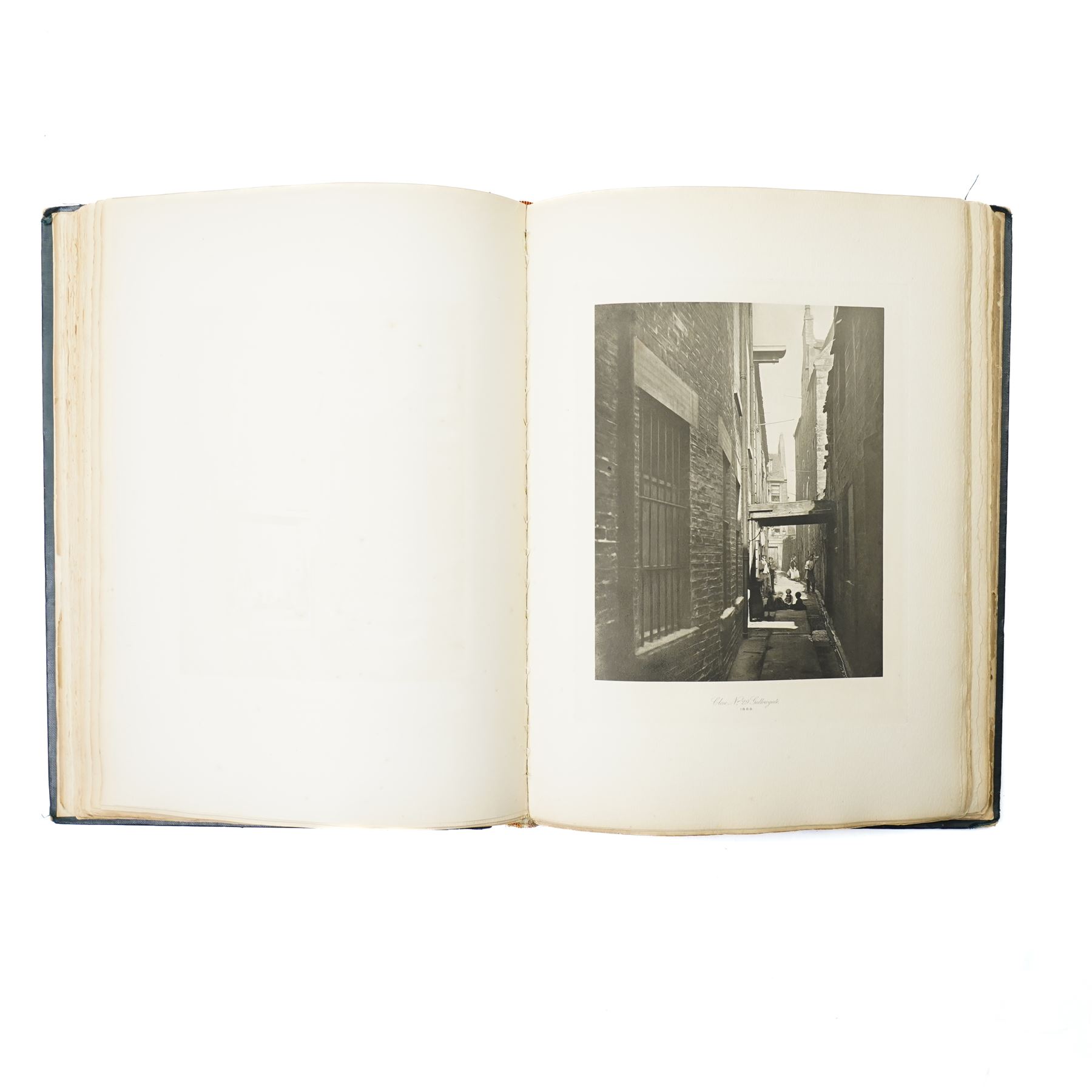 Thomas Annan (British 1829-1887) & Sons: 'Glasgow City Improvement Trust Old Closes and streets of Glasgow: A Series of Photogravures 1868-1899', folio pub. Glasgow: T. & R. Annan & Sons, 1900, folio limited to 100 copies specially printed for the corporation of Glasgow, title printed in red and black, 50 photogravure plates after Thomas Annan’s celebrated documentary photographs recording Glasgow’s wynds, closes and tenements prior to their clearance, printed on thick paper, original blue cloth gilt