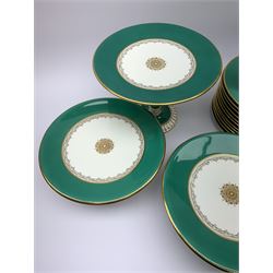 A Victorian dessert service, comprising two tazzas, four comports, and twelve plates, with green banded decoration heightened with gilt, with pattern number 1717 beneath, tazzas H16cm, comports H7cm, plates D23cm