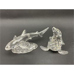Nineteen Swarovski Crystal sea creatures, to include dolphins, seals, puffer fish, octopus, crabs, together with a quantity Swarovski Crystal shells 