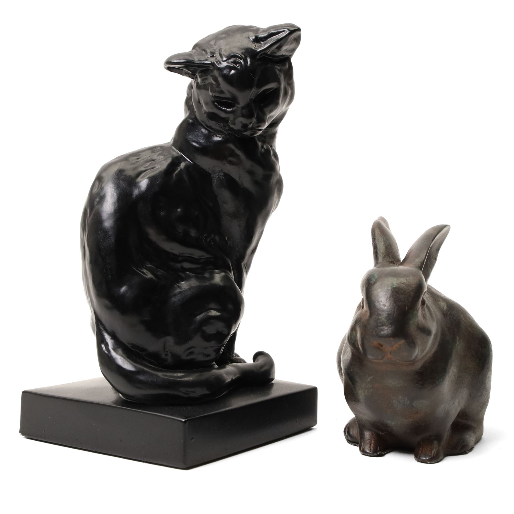Two commemorative bronze medallions, each depicting horses, the first with 'Salon du Cheval Paris 1975 - Juge' plaque, the other from the Asociación Española de Criadores de Caballos Árabes, together with further decorative composite animals, including a cat after  Emmanuel Frémiet, and others (7)
