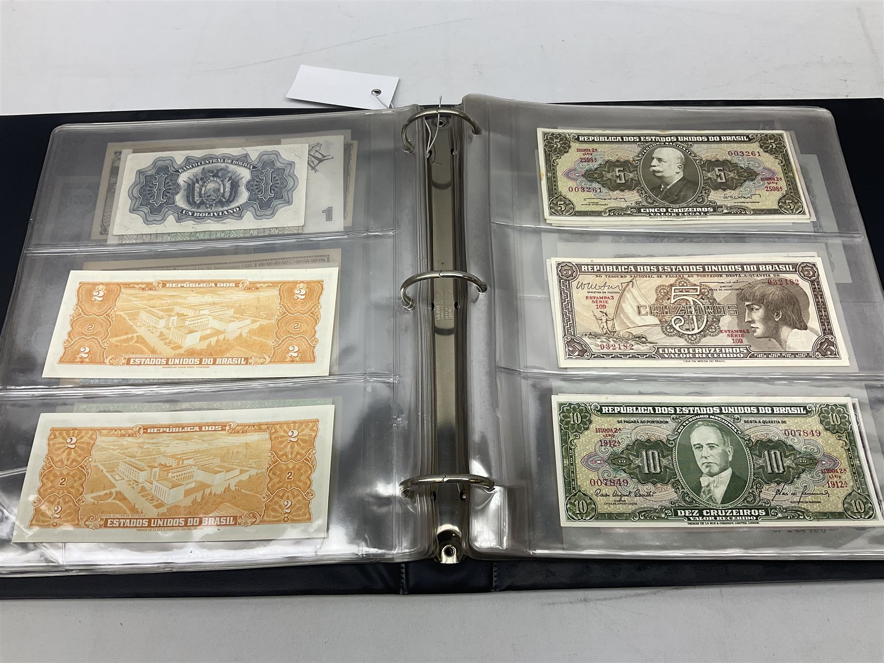 World banknotes, including Queen Elizabeth II The States of Jersey one pound 'DB202703', five pounds 'BB527762' and ten pounds 'AB651481', reserve bank of New Zealand two dollars '1L3 741894', King George V Straits Settlements one dollar 1st January 1935 'F/83 28924', various Bank of England notes etc, housed in two ring binder albums