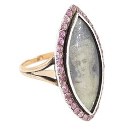 18th / 19th century gold and silver paste stone set portrait ring, the navette bezel set with a miniature of a woman on ivory, under a glazed panel, within a pink paste border and trifurcated shoulders. This lot has been registered for sale under Section 10 of the APHA Ivory Act