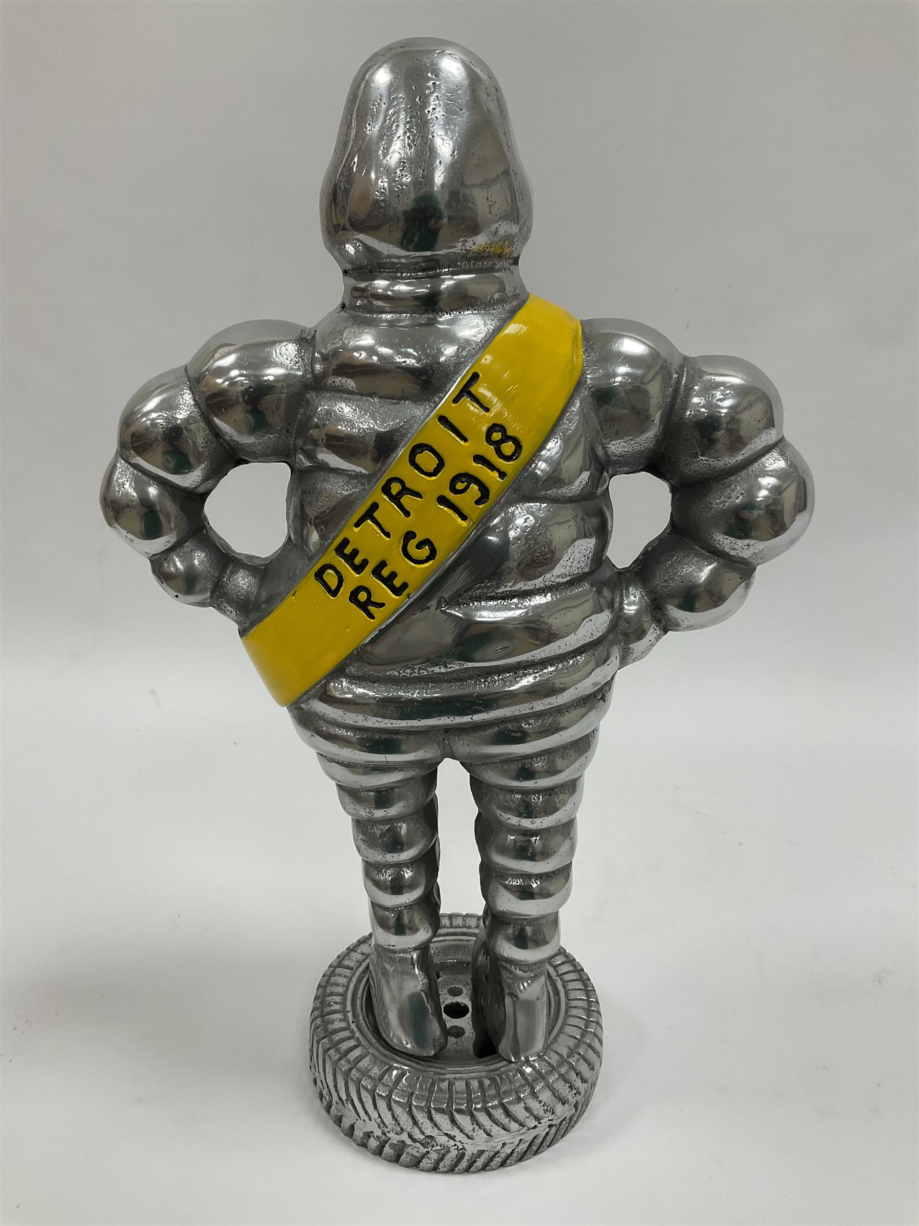 Polished aluminium Michelin man style figure, H38cm.