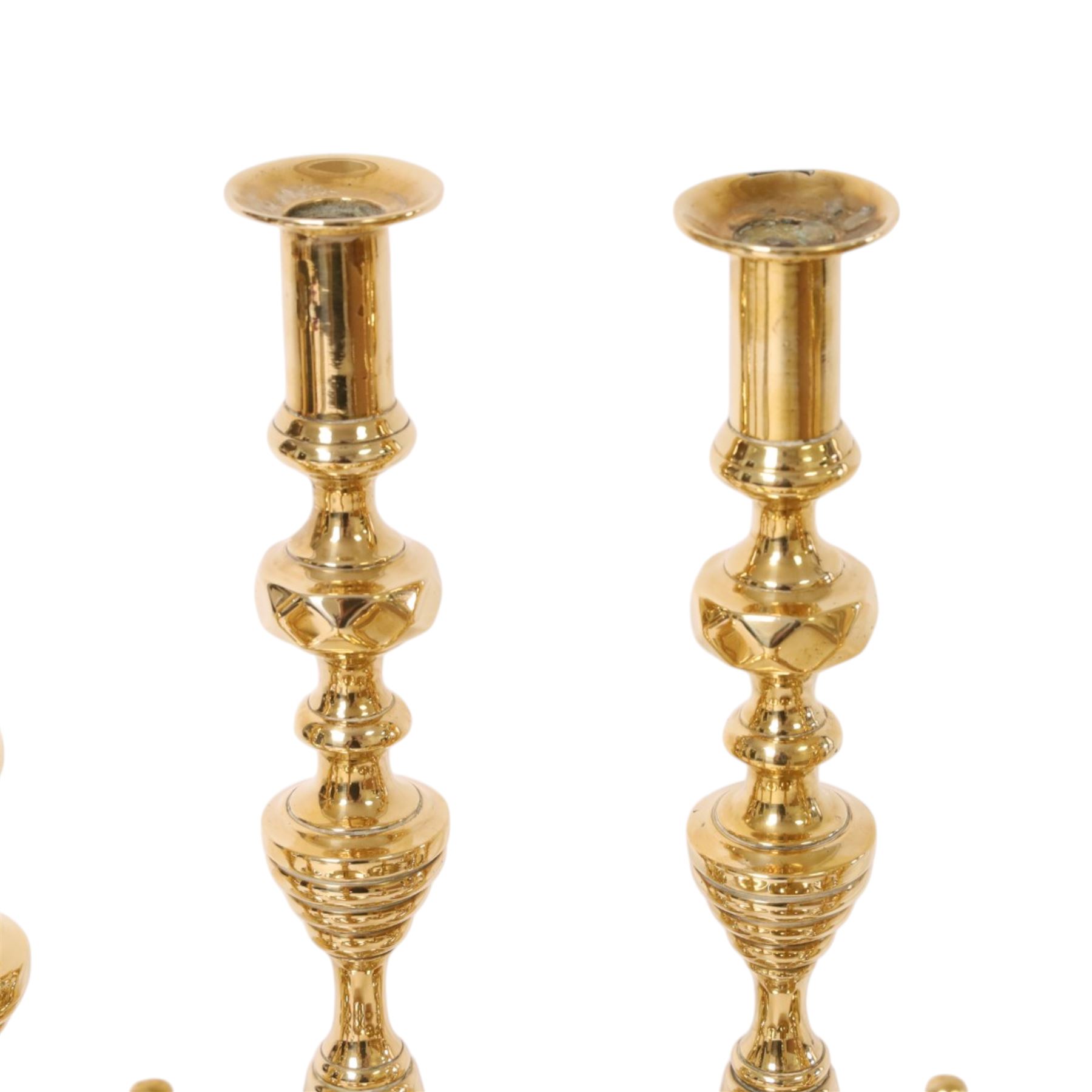Pair of 19th century brass chamber candlesticks with detachable snuffers, together with three pairs of brass candlesticks 