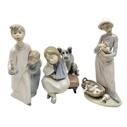 Three Lladro figures, comprising My Puppies no. 5807, We can't Play no. 5706 and Bedtime no. 4874, largest H20cm