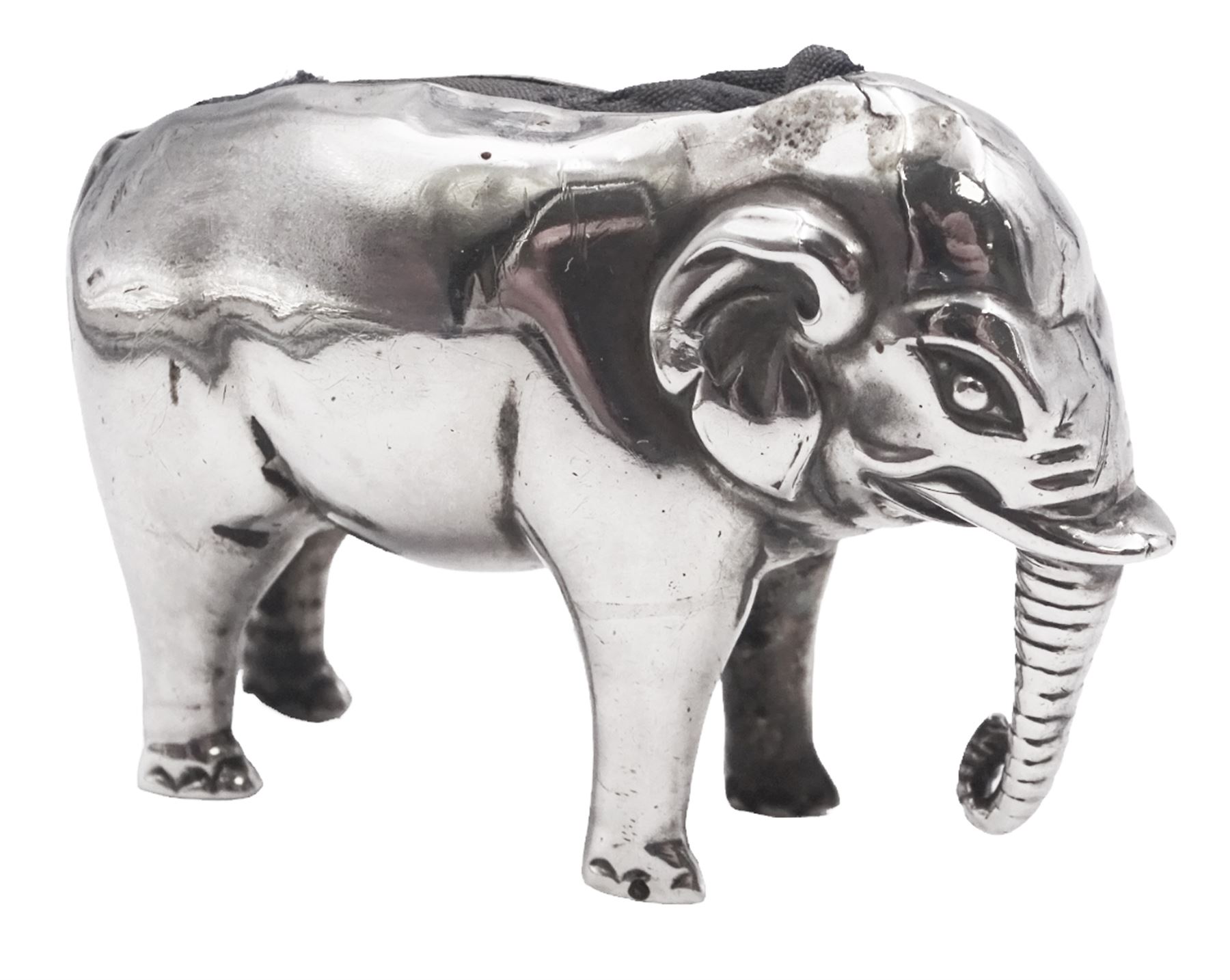 Edwardian silver novelty pin cushion, modelled as an elephant with cushioned back, hallmarked Birmingham 1906, maker's mark indistinct, H3.2cm, approximate total weight 0.46 ozt (14.1 grams)