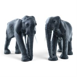 In the style of Liberty & Co - pair of 20th century ebonised leather elephants