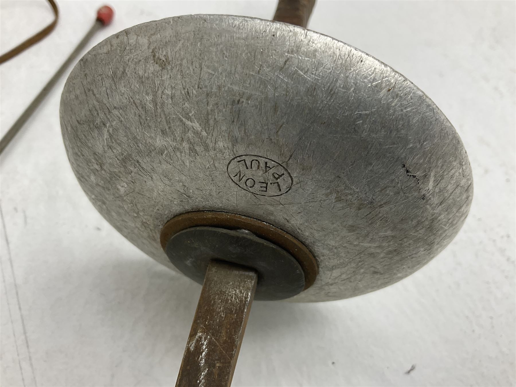 20th century Indian Tulwar sword with 71cm plain curving steel blade and iron hilt with extended langets, knopped grip and spiked pommel; in canvas covered wooden scabbard L87.5cm overall; together with five fencing swords comprising four foils and one epee, three marked Leon Paul, one in carrying case (6)