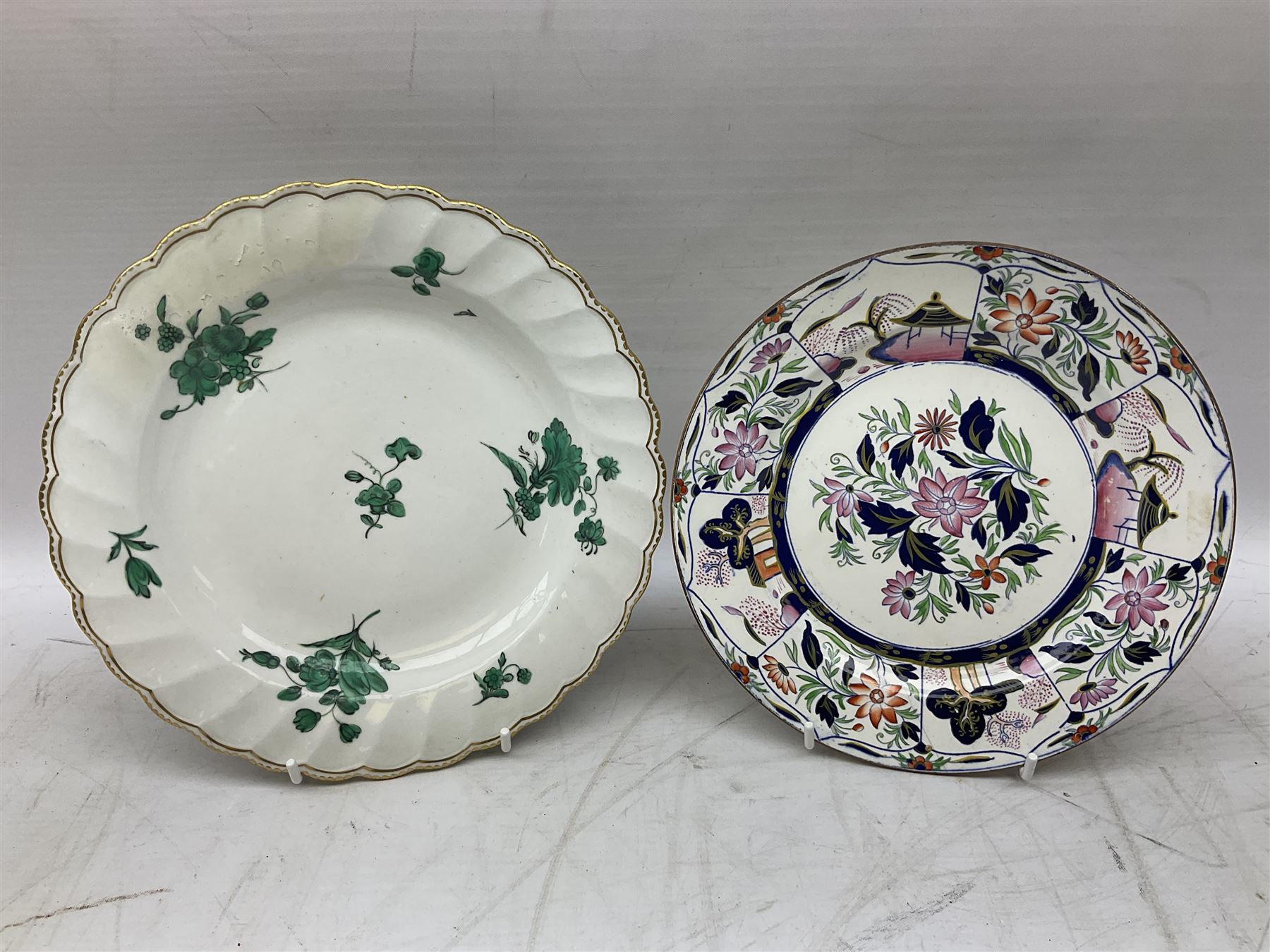 Mid 18th century Chelsea plate with gold anchor mark beneath, decorated with green floral sprays upon plain ground, the moulded cavetto shaped border with gilt rim, (A/F), D22cm, together with early 20th century Adams Tunstall Tokio pearlware slop bowl, Spode plate decorated in the Imari type pallette, with impressed and printed marks beneath, 19th century Indian Tree pattern breakfast cup and saucer, small polychrome enamelled vase and cover in the style of Samson of Paris, with marks beneath, and a pastille burner