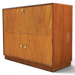 Teak mid 20th century fall front cabinet, hinged top with geometric inlay front, above twin cabinet doors