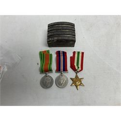 WWII service medal trio comprising Defence Medal, 1939-1945 medal and 1939-1945 Star, with various ribbons and box