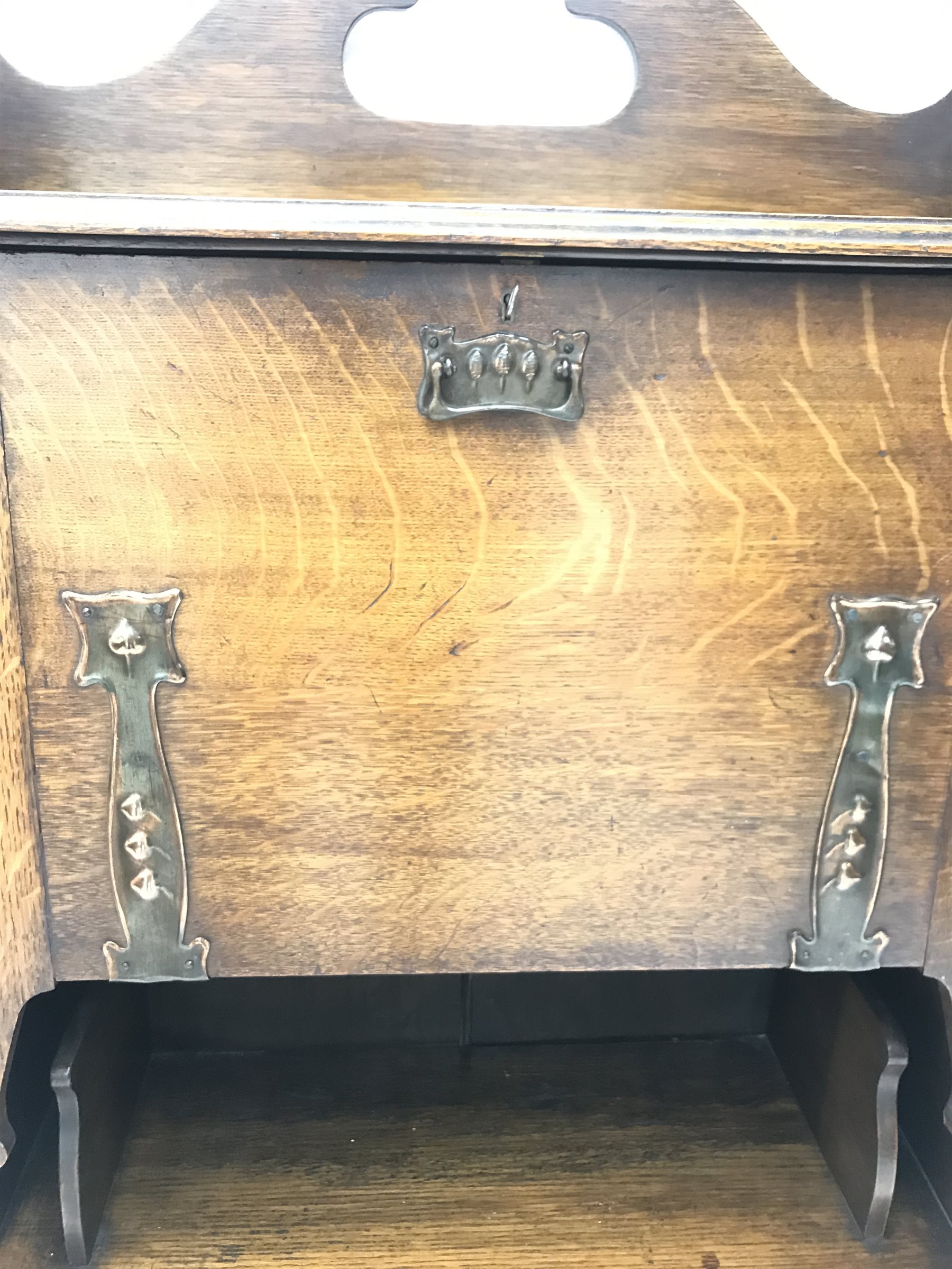 Art Nouveau period oak writing desk with decorative anodised strap