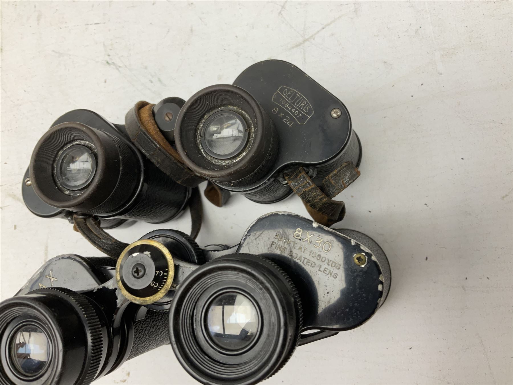 Twelve pairs of binoculars to include BWCF 7x35 Extra Wide Angle, Carl Zeiss Jena Delturis 8x24, Carl Zeiss Jena Jenoptem 8x30W, Chinon Countryman 10x50,  Ajax 8x30, Regent 16x50, etc,  some with cases