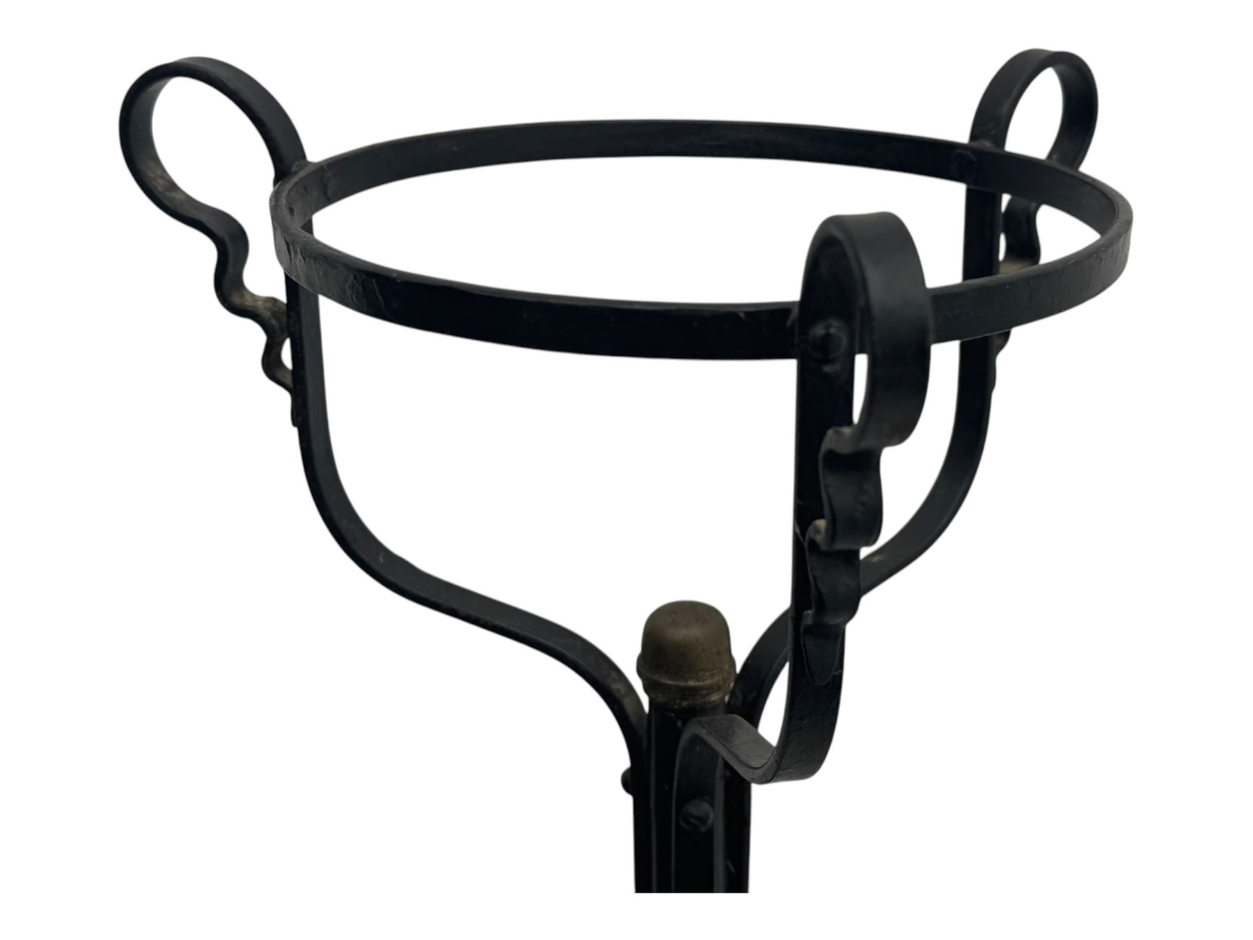 Late 19th century wrought iron and brass pulpit lamp, featuring an adjustable stem with a spiral twist detail, brass foliate mounts, and a tripod base with scrolled feet and decorative floral accents