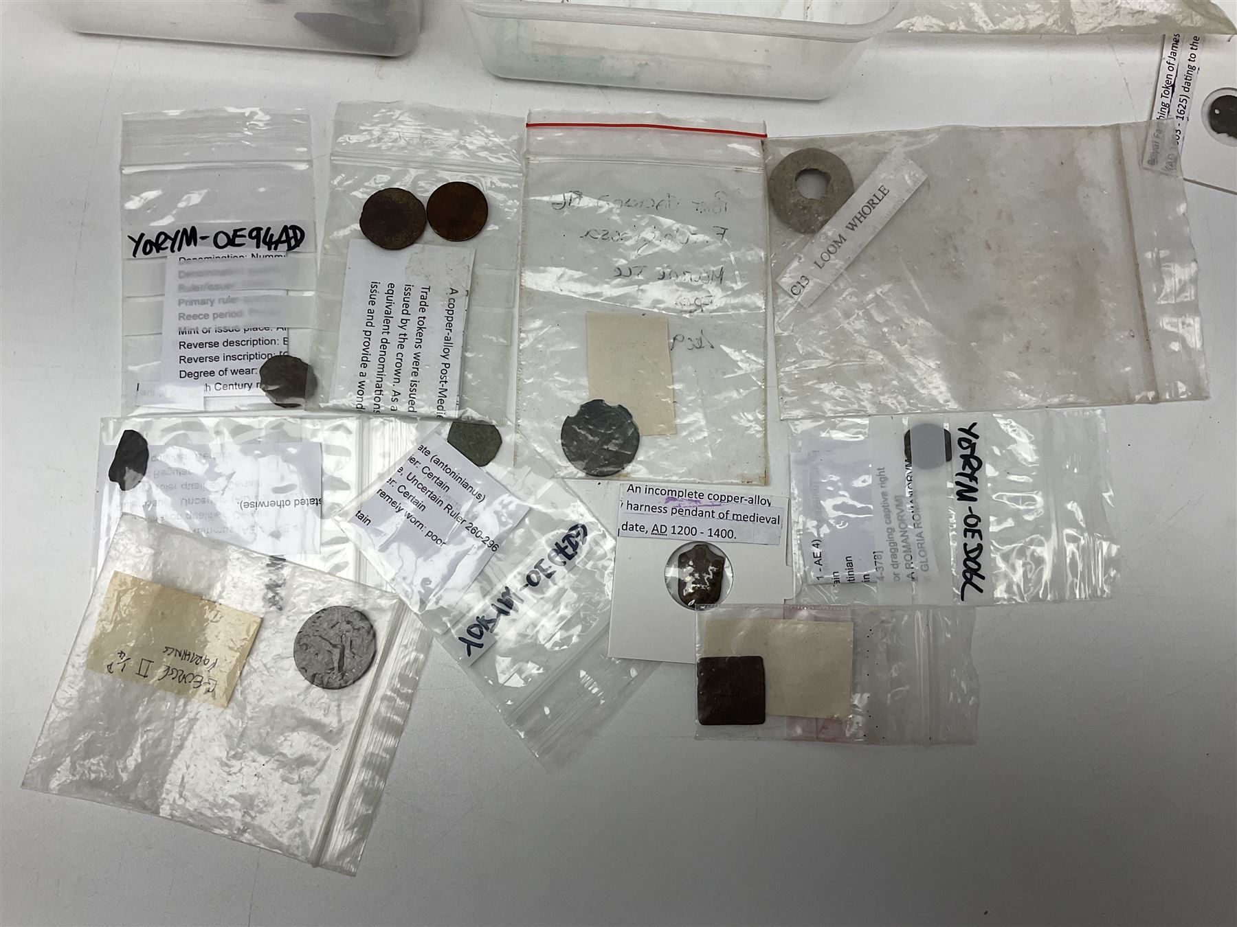 Collection of metal detector finds, to include Neolithic, Roman, medieval  specimens, musket balls, book bindings, tokens, shrapnel etc, 