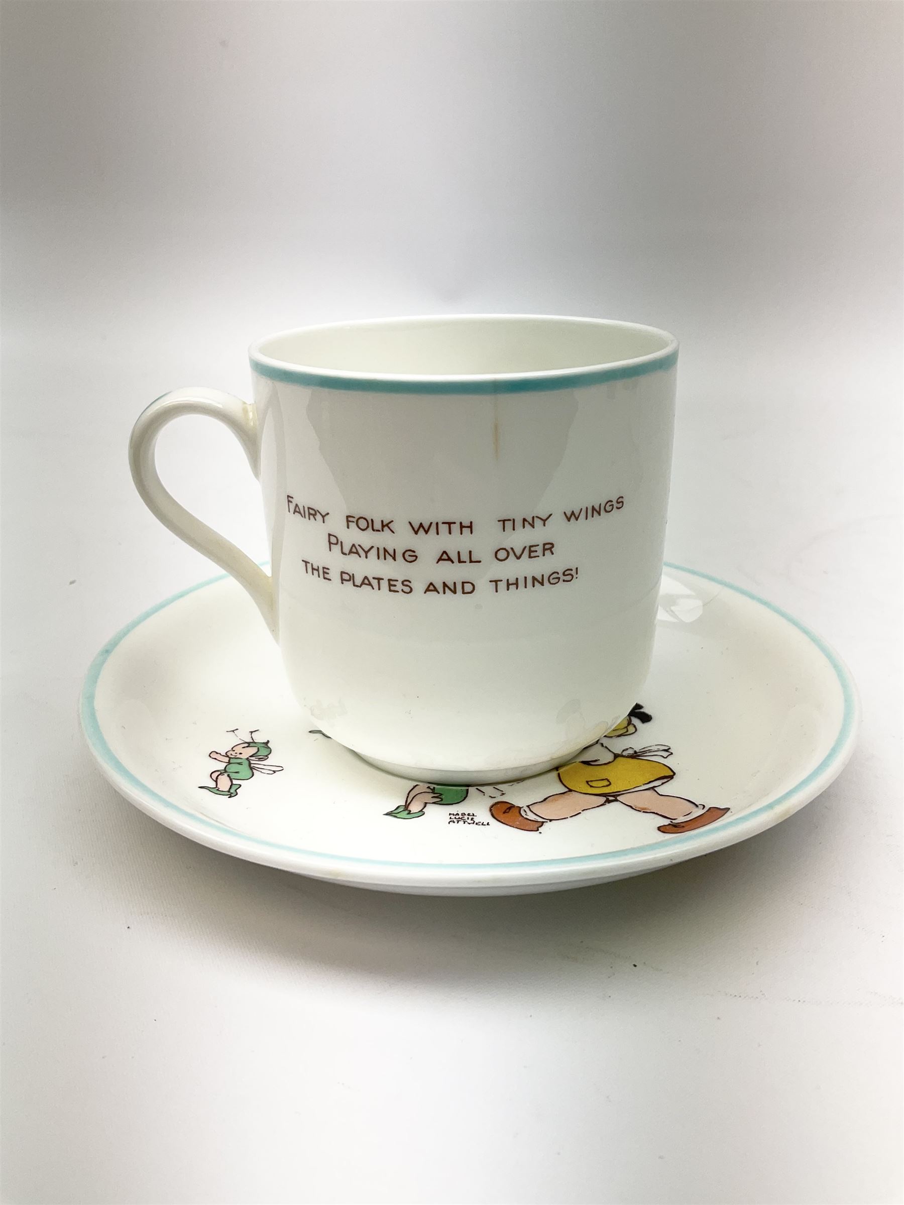 Shelley Boo Boo three piece tea set designed by Mabel Lucie Attwell, comprising teapot modelled as a house, sugar bowl modelled as a toadstool, and creamer modelled as an elf, each with printed marks beneath, together with a Shelley Mabel Lucie Attwell teacup and saucer. 