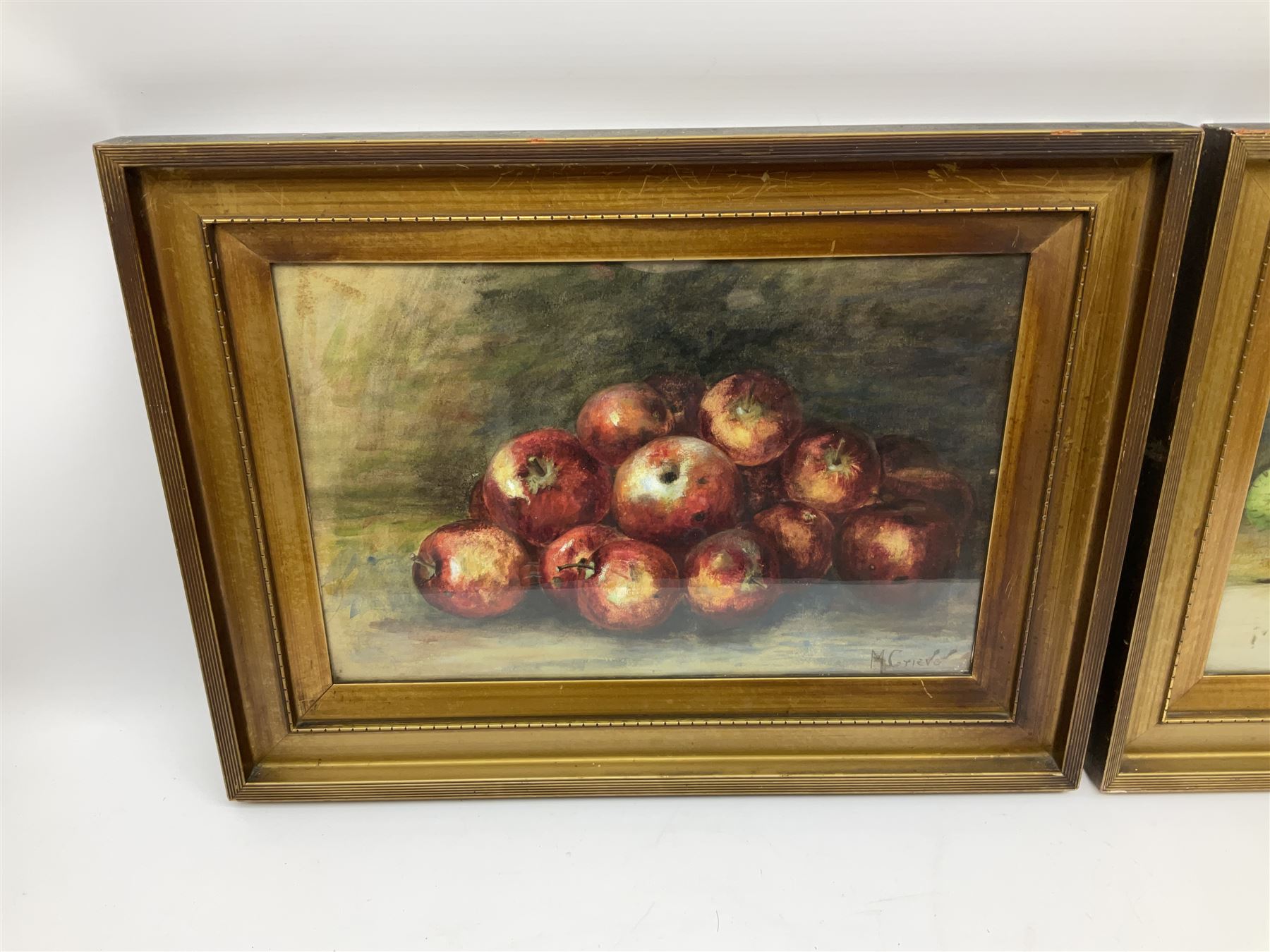 M Grieve (British 20th century): Still Life of Apples and Still Life of Mixed Fruit, pair pastel and watercolours signed 30cm x 45cm (2)