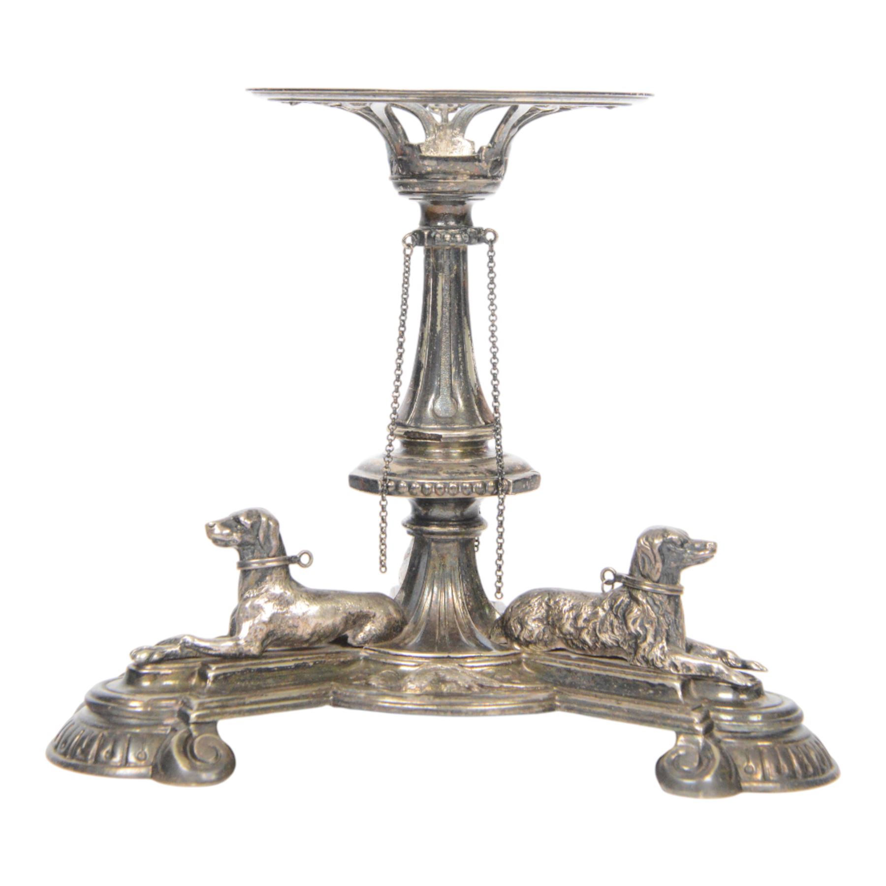Edwardian silver plated centrepiece stand, the tripart base with applied recumbent hunting dogs interspersed with fox masks and game birds, the central knopped and tapering stem leading to a circular stand, marked 3251 beneath, H22cm  