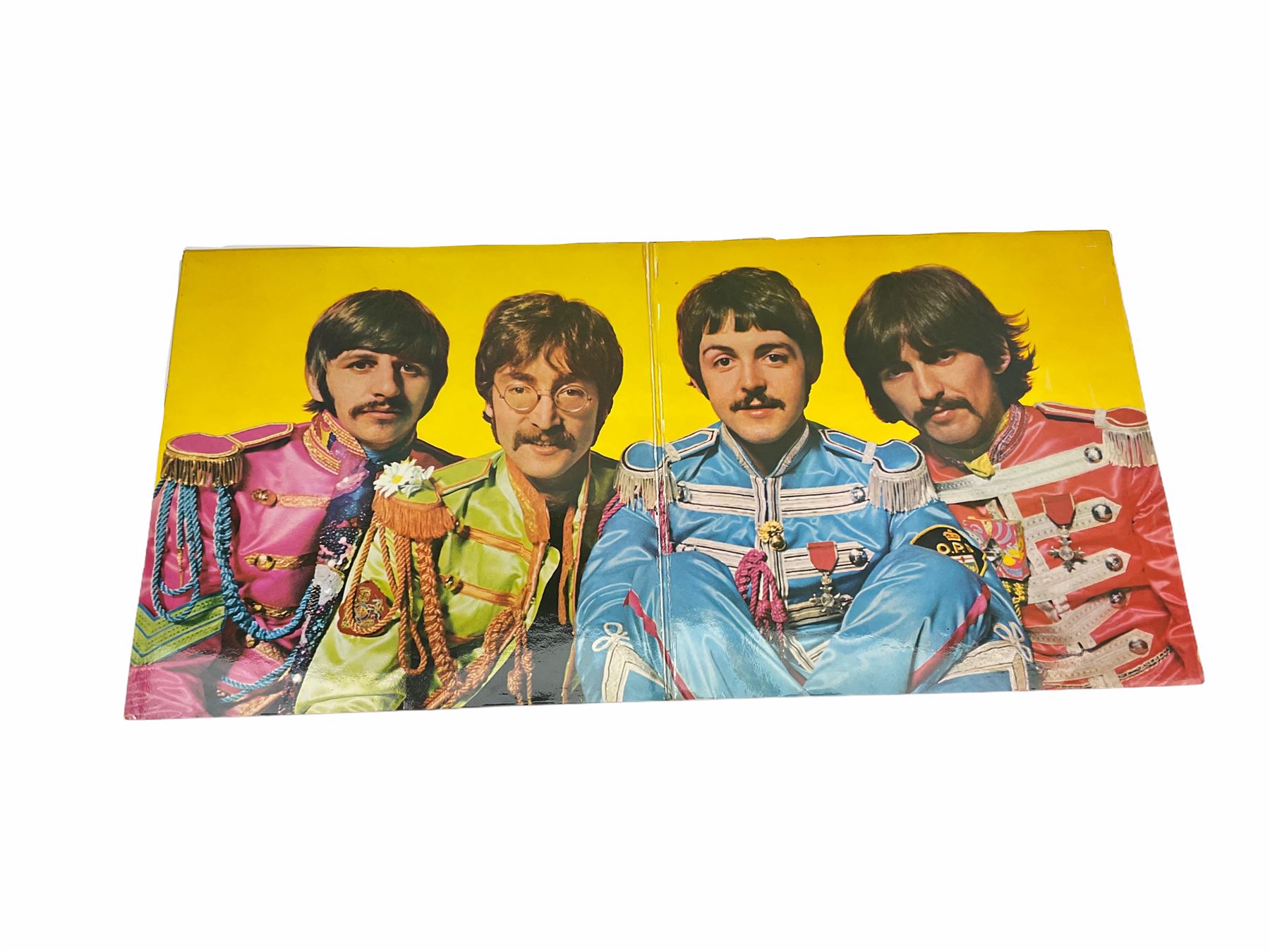 Mid 20th century Turkish film poster, 'Sevimli Mahkum' (After the Fox), H100cm L70cm, together with three other later posters, including one detailed 'Hair The America Tribal Love-Rock Musical', and a Beatles St Peppers Lonely Hearts Club Band vinyl record sleeve. 