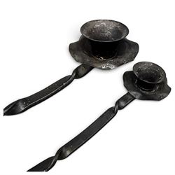 Collection of wrought iron candle stands, comprising five-light and three-light floor-standing candelabra with scrolling branches, and a pair of five-light table candelabra of naturalistic branching form