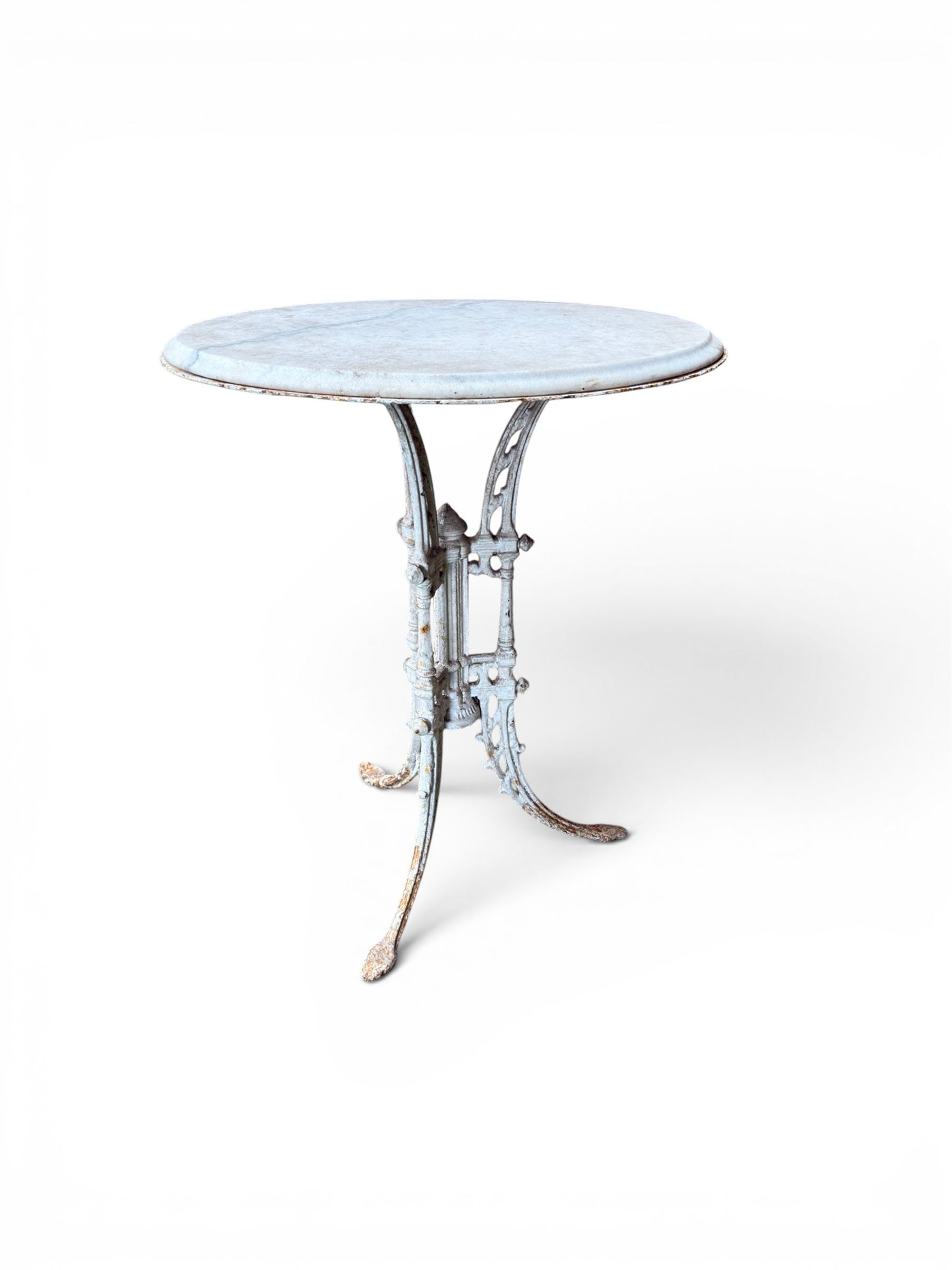 Victorian ornate cast iron garden table, trefoil base with central enclosed column, circular top with later marble, with registration mark