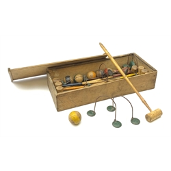 Table top wooden croquet set in the Victorian style with eight coloured mallets, eight corresponding balls, ten hoops and one wicket, in unmarked wooden box with sliding lid