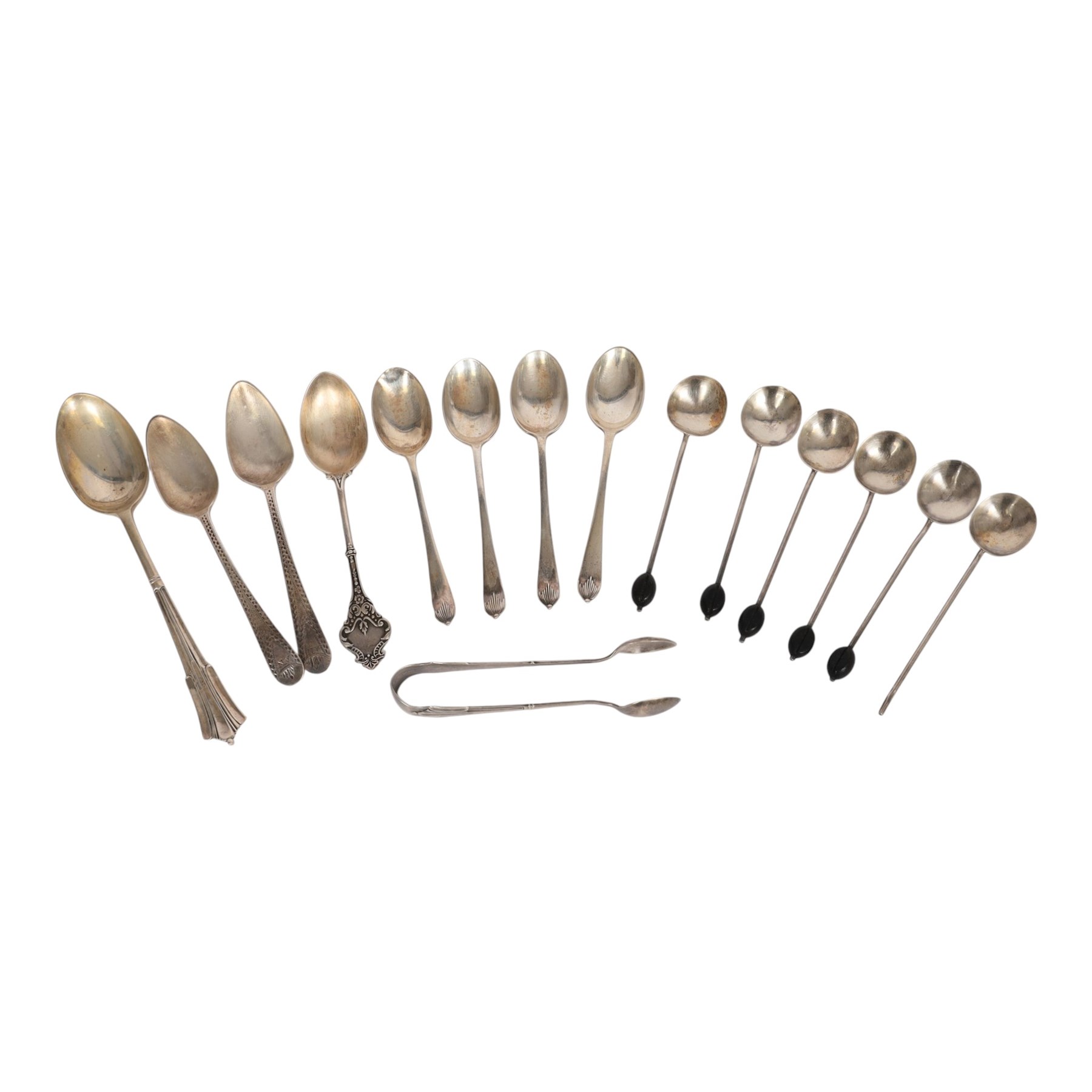 Collection of silver cutlery, including sugar tongs, coffee bean spoons, teaspoons, etc, all hallmarked