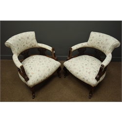  Pair Edwardian walnut framed tub shaped armchairs, upholstered in cream fabric with trailing floral decoration, W62cm  