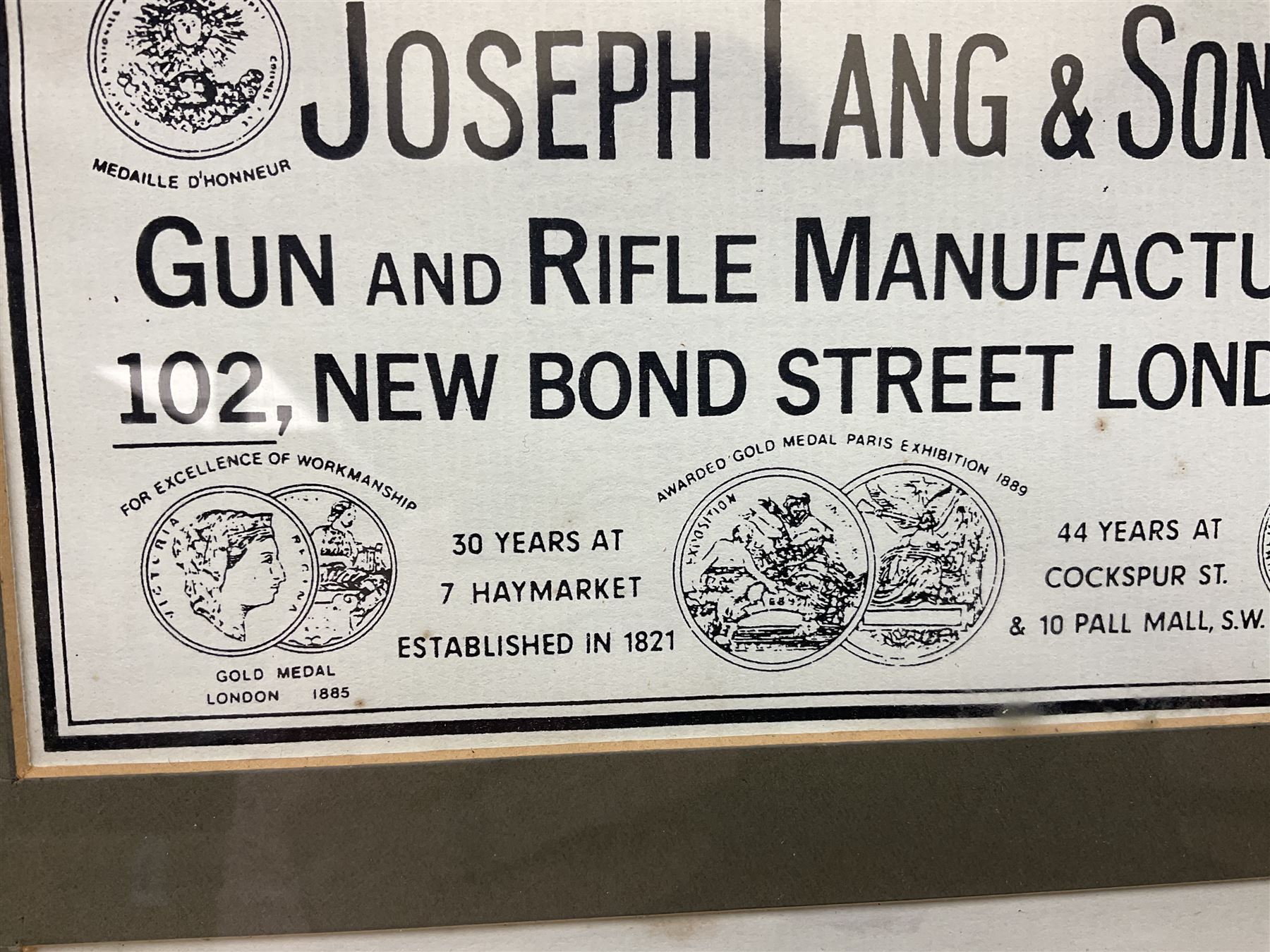 Framed display of three trade gun case labels for Joseph Lang & Son