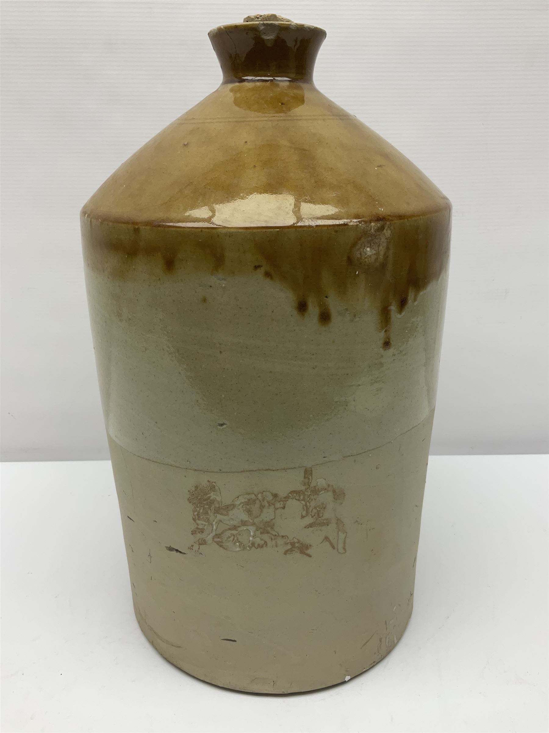 Large 2 gallon stoneware flagon, stamped 'John Soulby Wine Merchant Malton 2 Gall', together with a collection of similar stoneware jars and bottles, largest H40.5cm