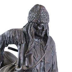 After Frederick Remington; The Mountain Man bronzed spelter figure of a native American trapper upon a marble base with plaque, H72cm