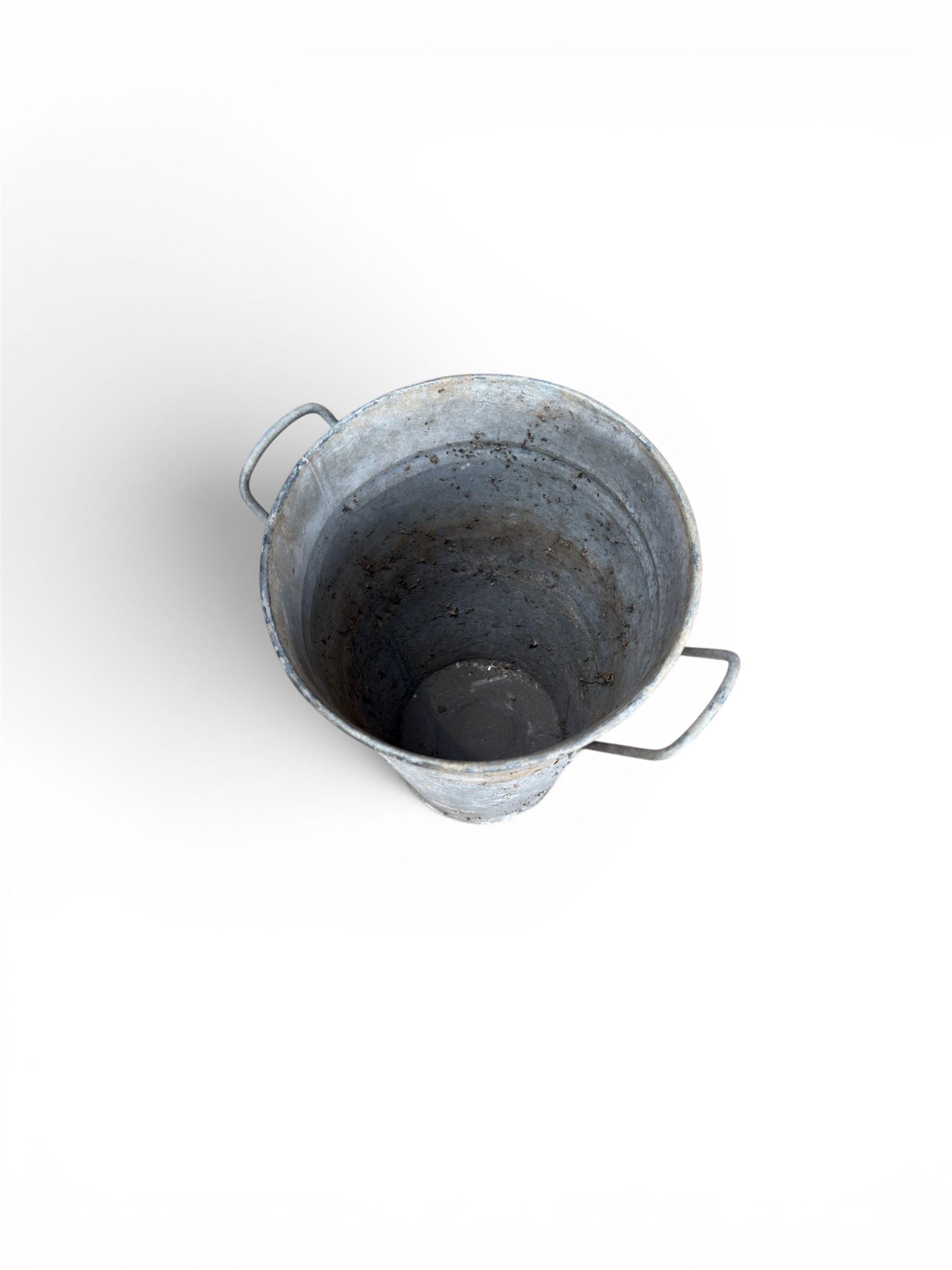 Nine galvanised flower buckets, tapering form with twin handles